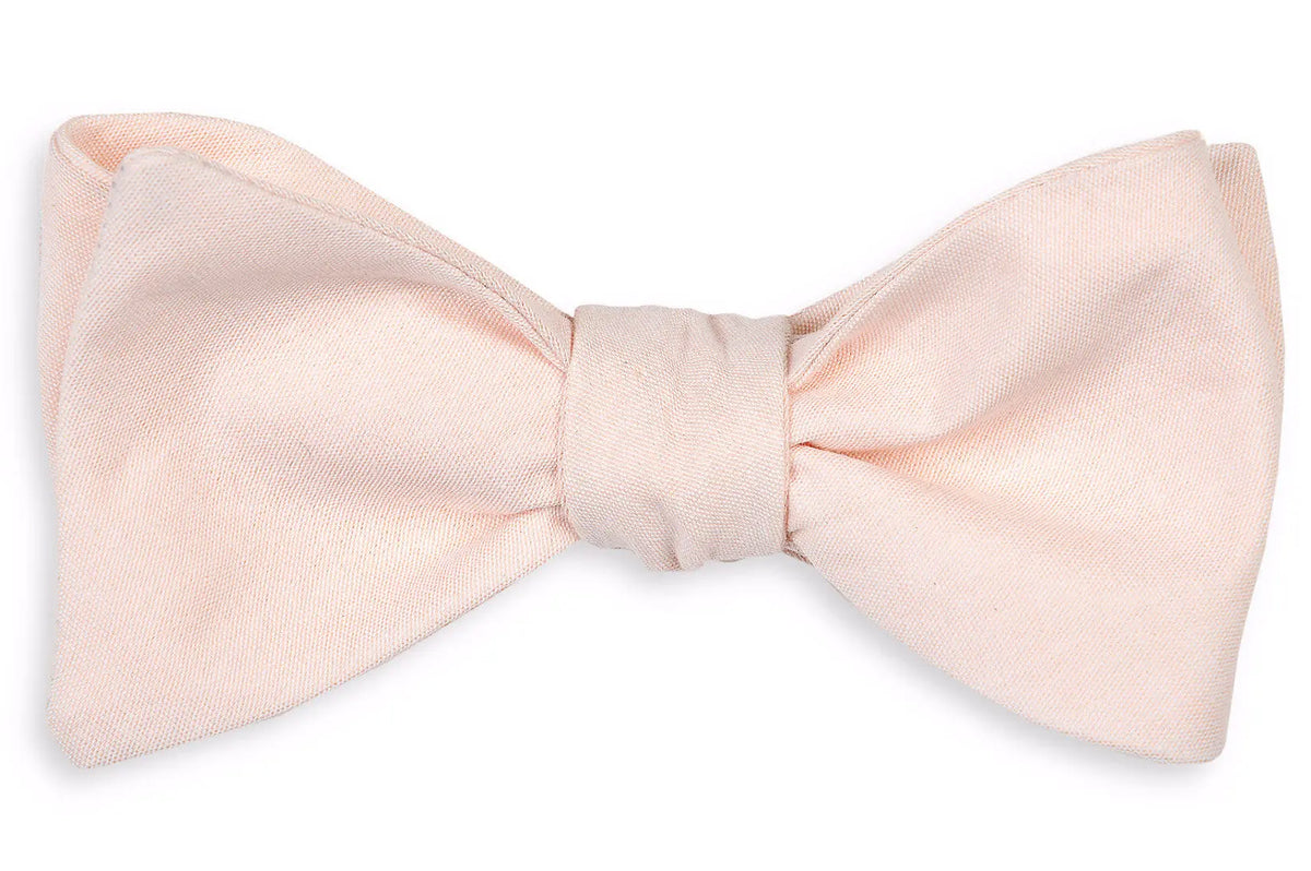 Men's peach colored bow tie. Made from 100% cotton.