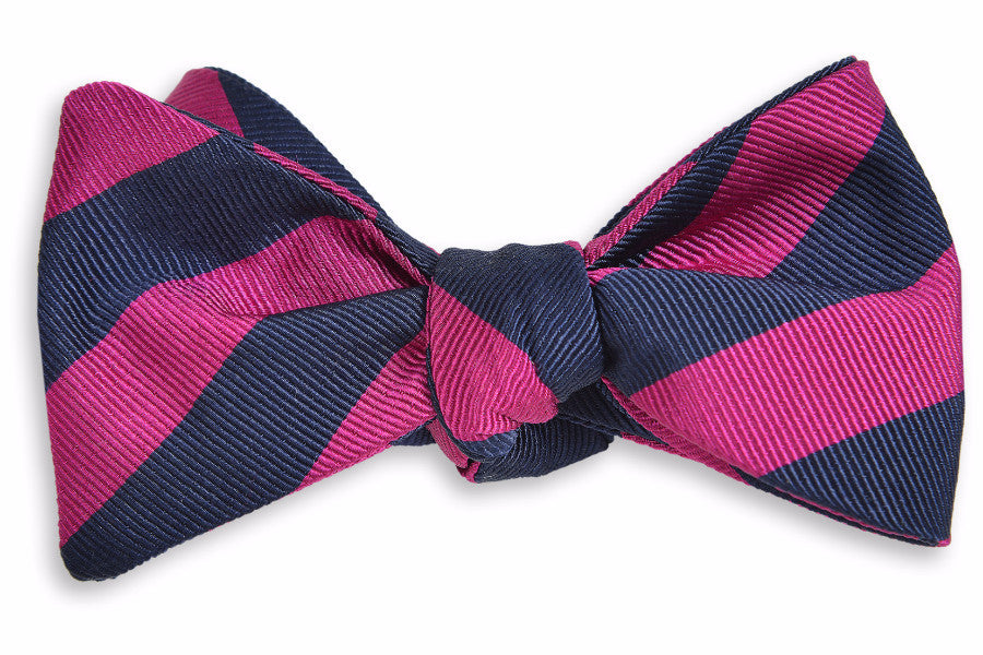 Navy and pink striped men&#39;s bow tie. Made from 100% silk.