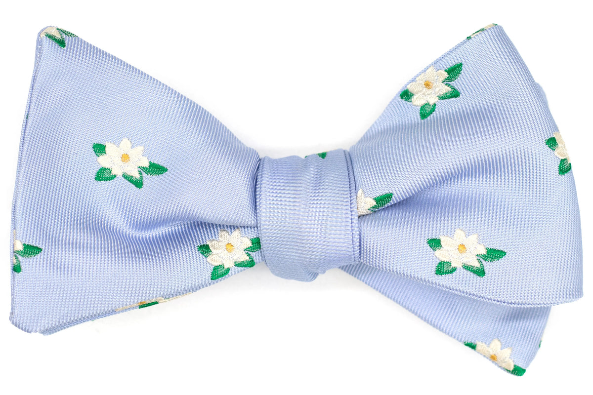 magnolia flowers on a periwinkle mens bow tie.