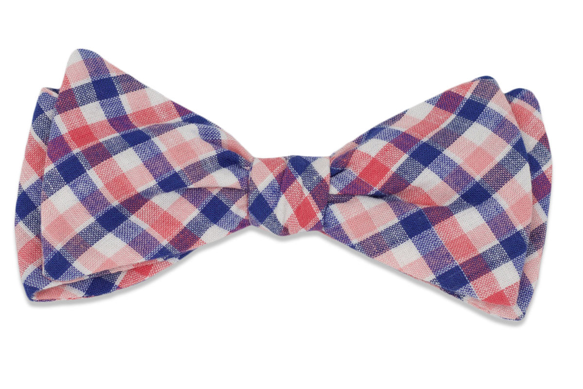Pink and blue men&#39;s bow tie. Made from cotton with a checkered pattern.