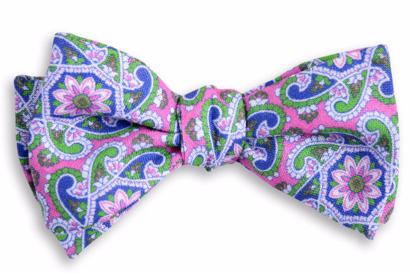 Men's pink bow tie. Made from 100% linen featuring a paisley green design.