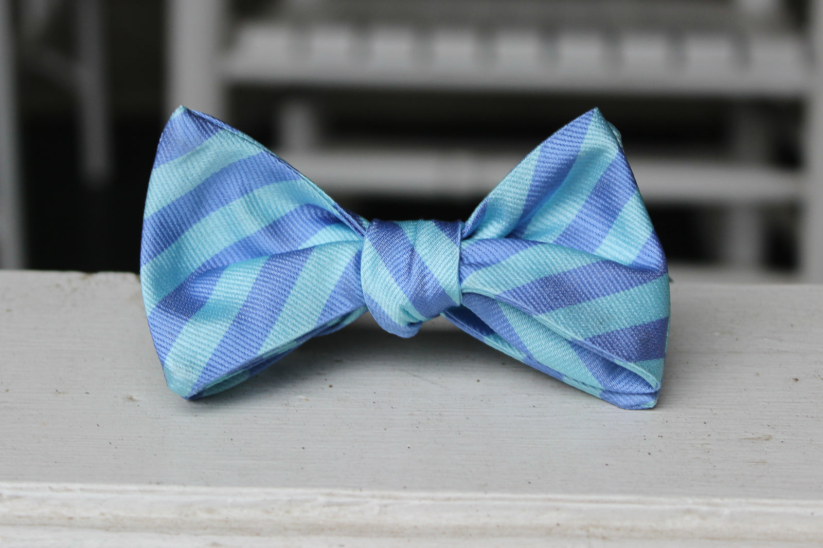 silk mens self tie bow tie with blue stripes.