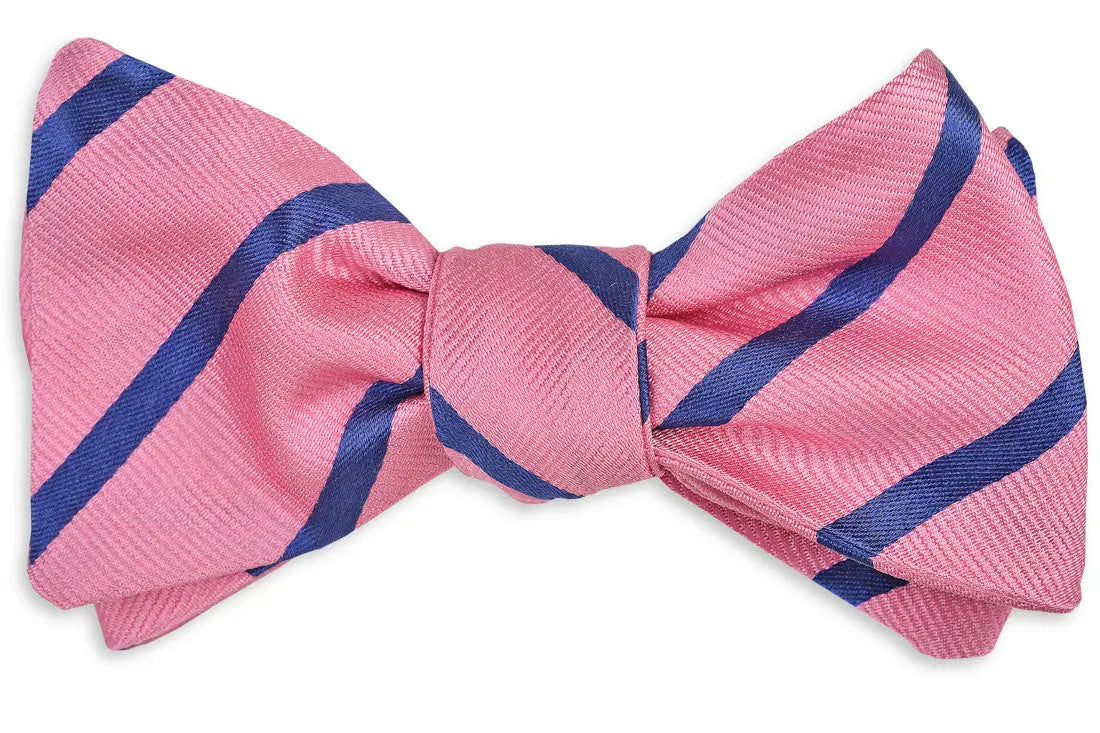 Men's pink bow tie. 100% silk with a blue striped design.
