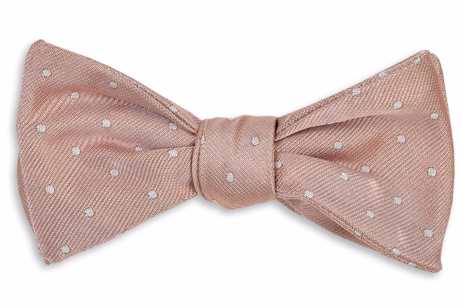 Men's blush bow tie. Made from 100% silk featuring a polka dot pattern.