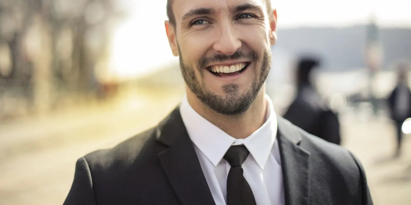 Black-Suit-Bold-Tie-Decoding-the-Perfect-Hue High Cotton