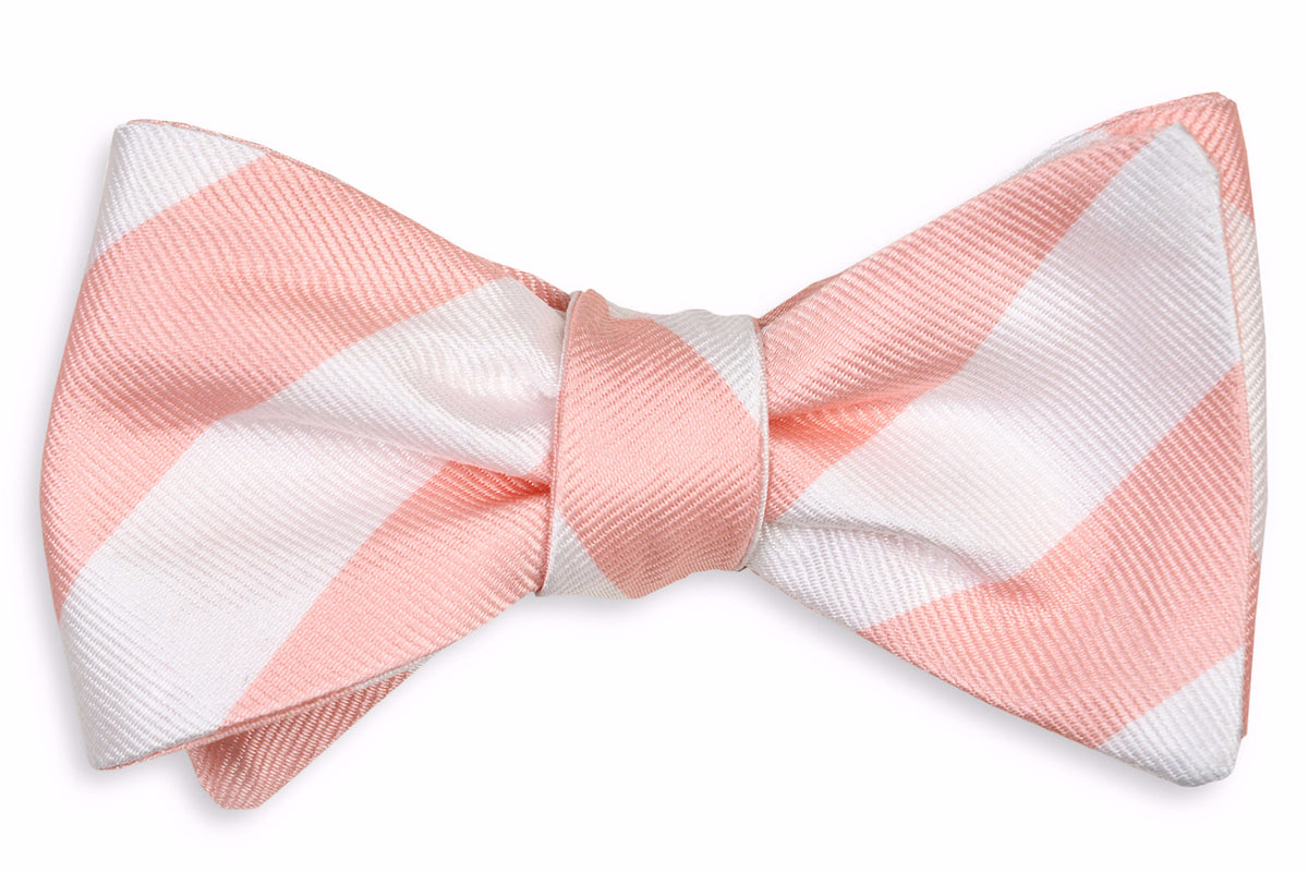 Men&#39;s silk bow tie featuring a peach and white striped design.