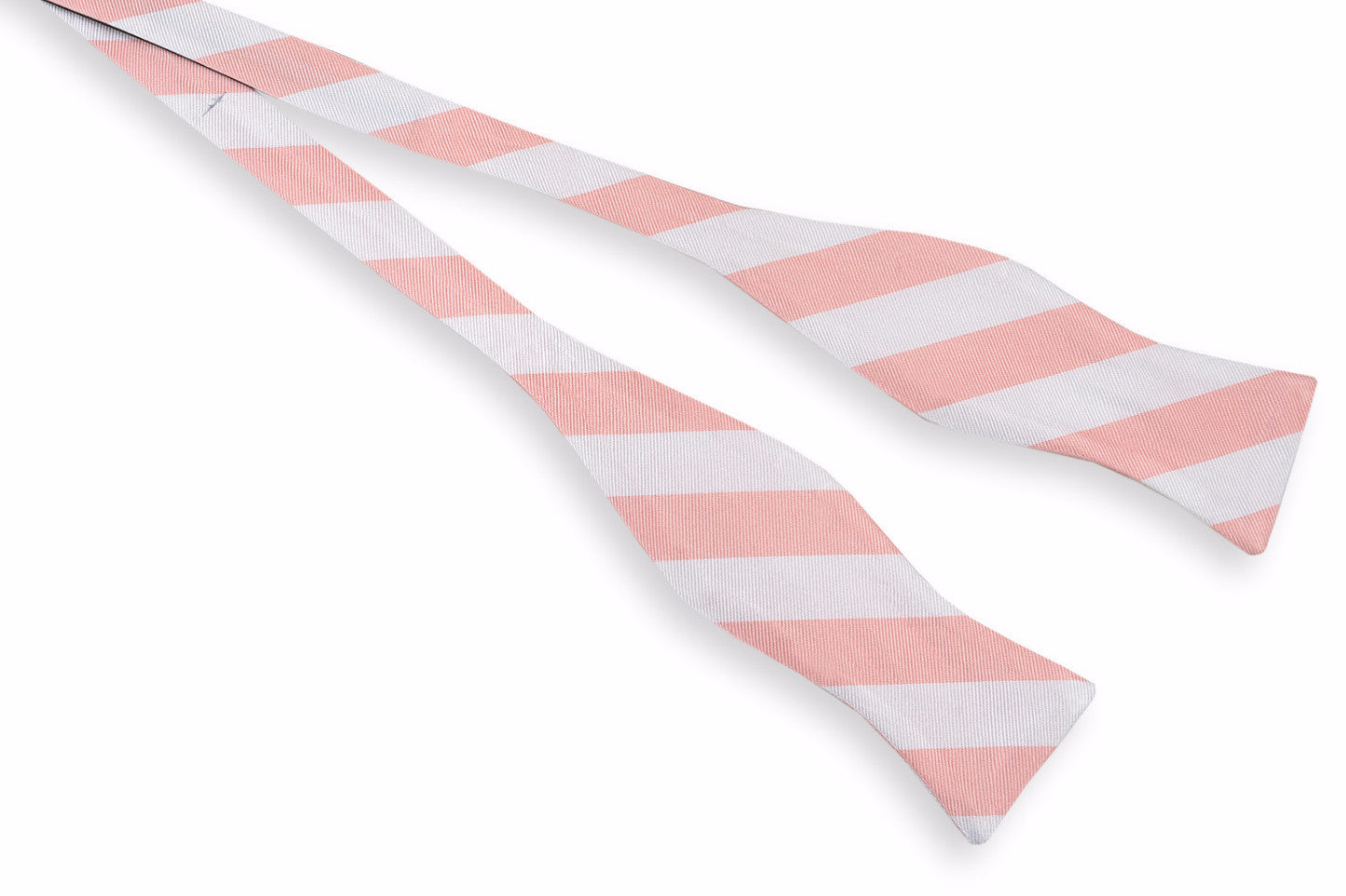Men's silk bow tie featuring a peach and white striped design.