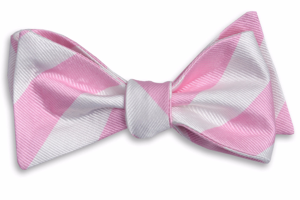 Men&#39;s pale pink bow tie. Made from 100% silk featuring white stripes.