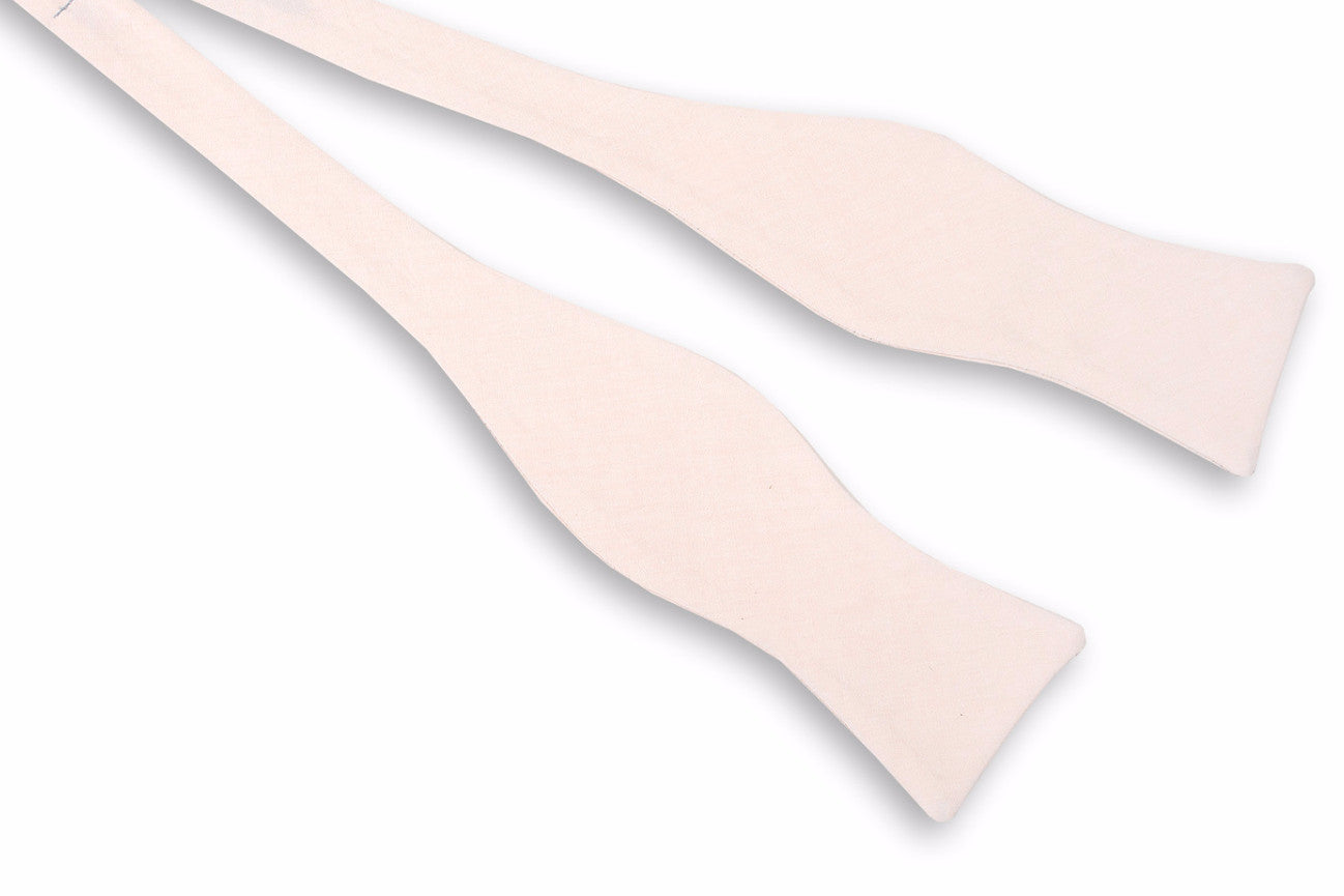 Men's peach colored bow tie. Made from 100% cotton.