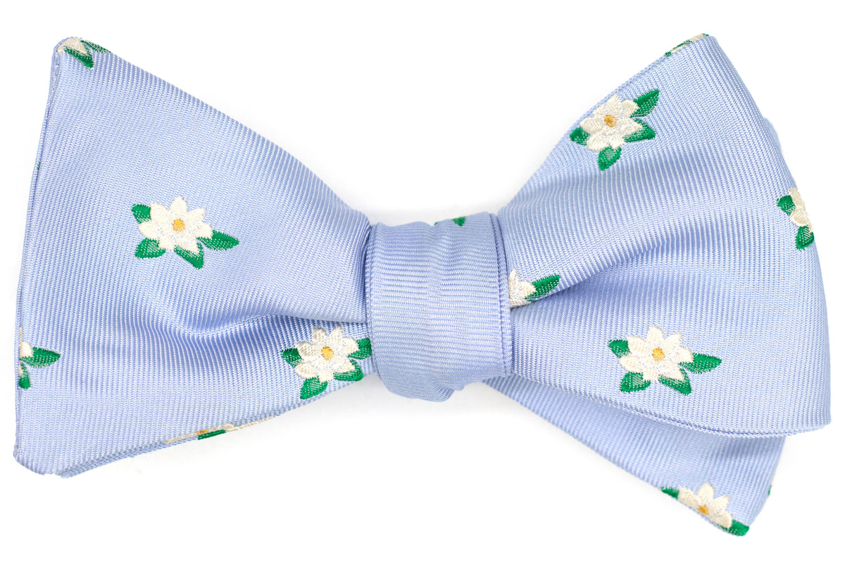 magnolia flowers on a periwinkle mens bow tie.