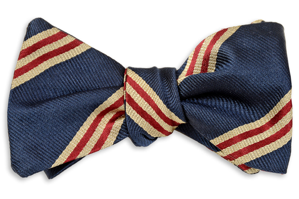 Cambridge Stripe Bow Tie is made of silk. This mens bow tie is navy with red and gold stripes.