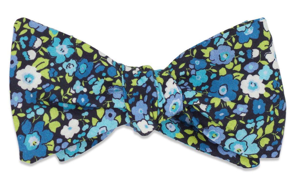 cotton mens bow tie featuring a blue floral pattern.