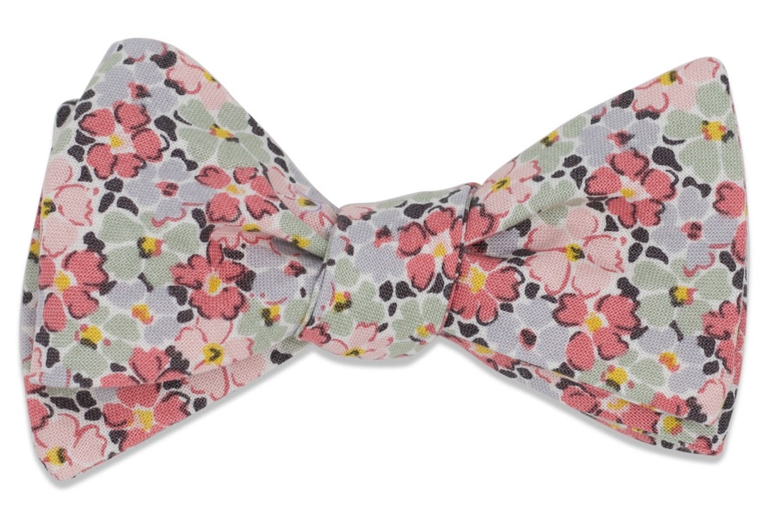 Men&#39;s pink floral bow tie made from 100% cotton.