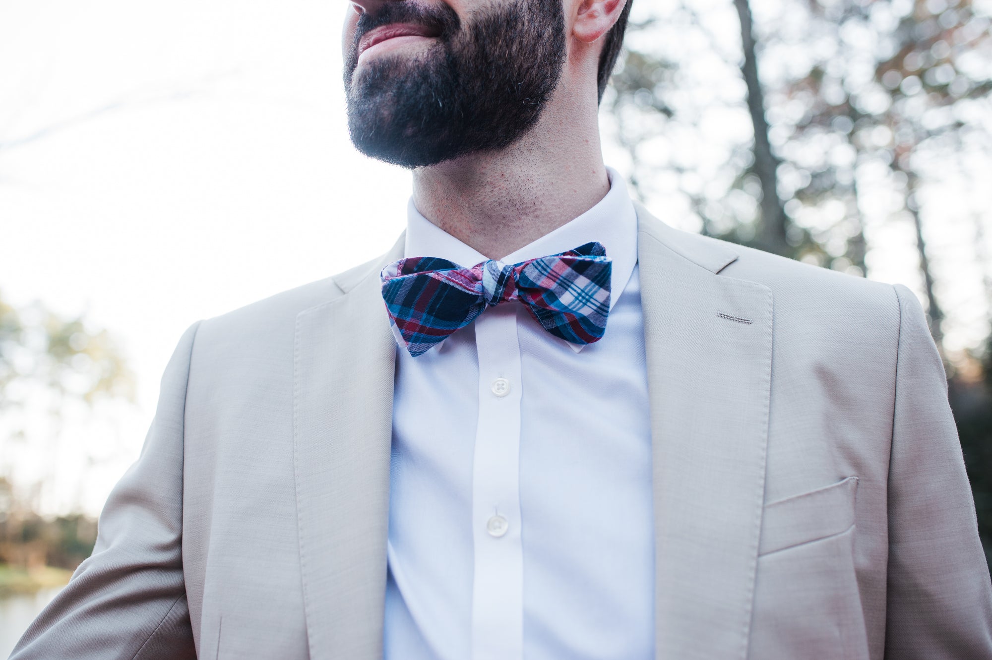 plaid mens bow tie, featuring a red, white, and blue design.