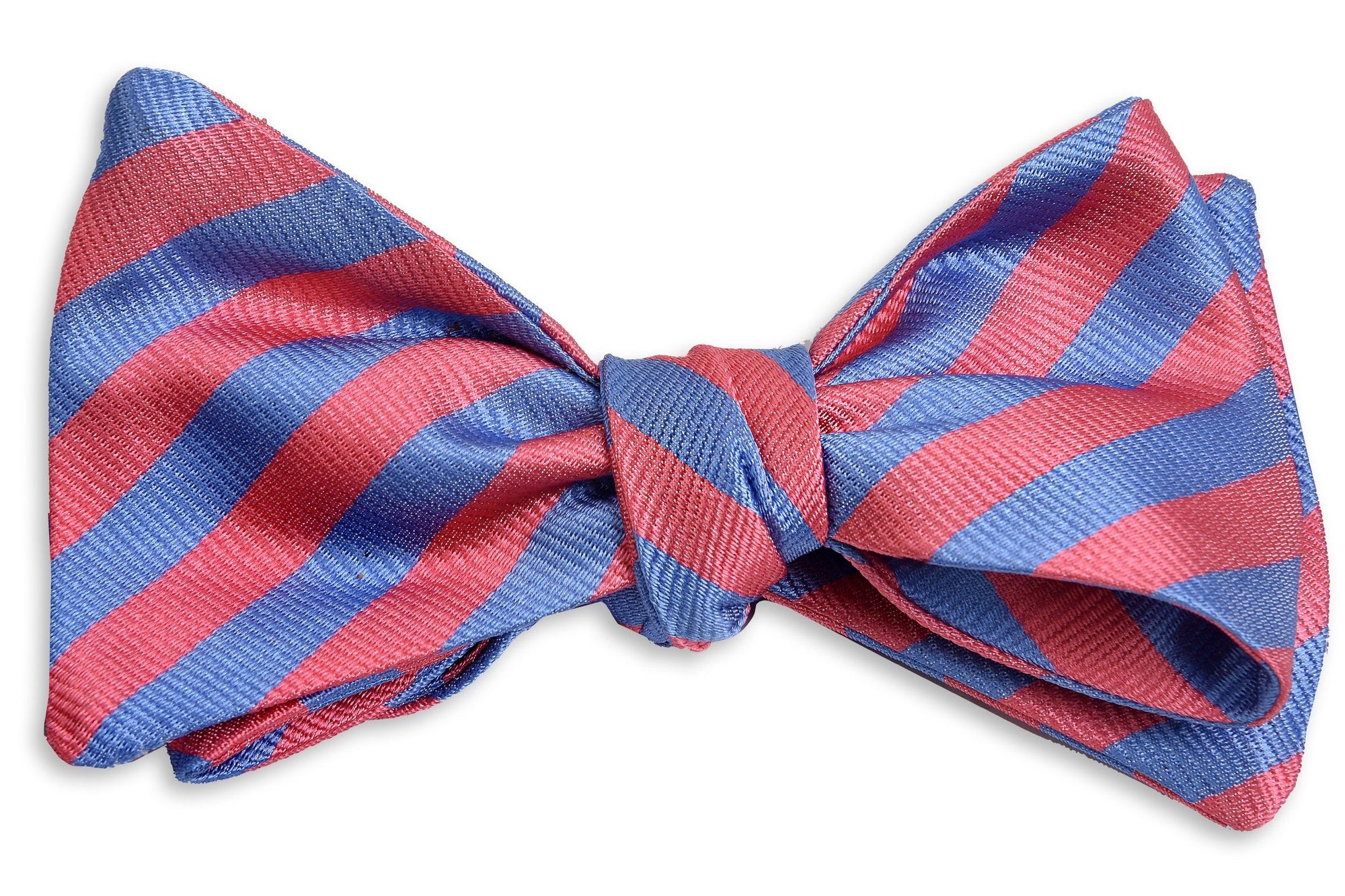 Pink and blue men's bow tie. Made from 100% silk with a striped pattern.