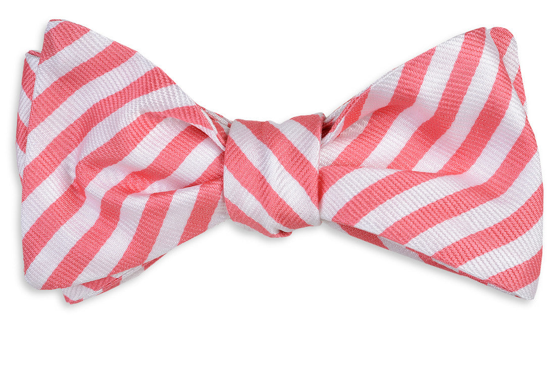 Men&#39;s pink bow tie. 100% silk with a white striped design.