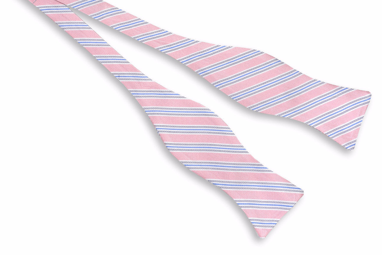 Men's pink bow tie. 100% silk with a blue and white striped design.